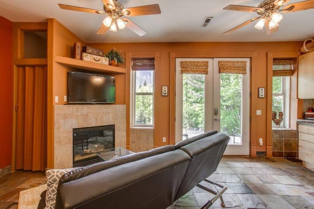 Comfortable living room with automatic gas fireplace and large tv
