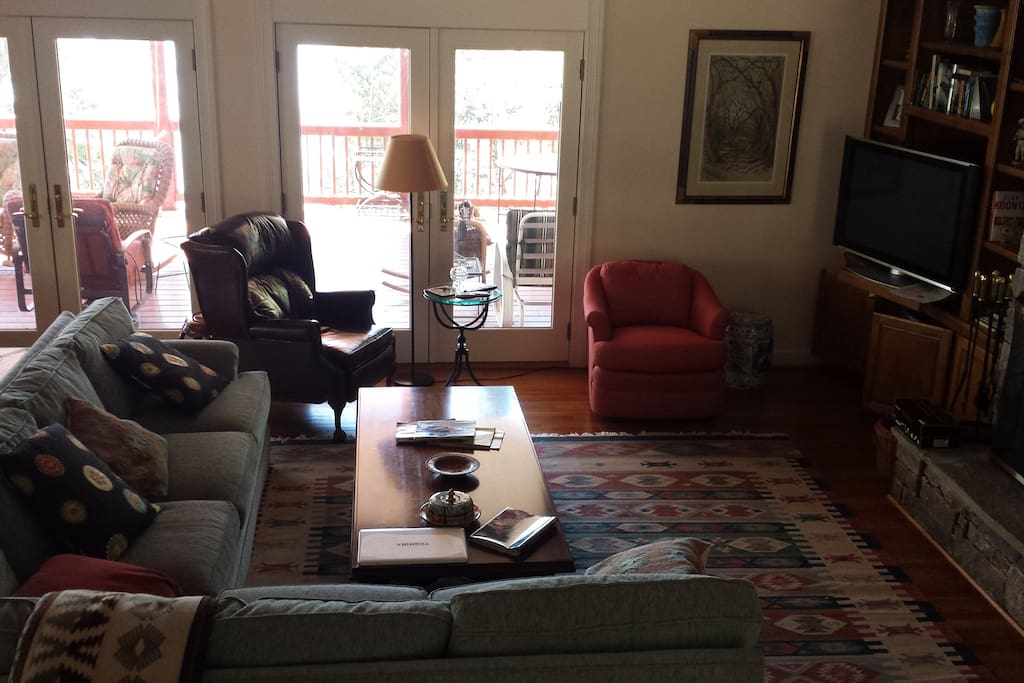 Cozy sitting room (downstairs) with stone fireplace