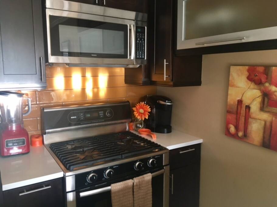 Kitchen: Bosch stainless steel kitchen appliances, includes refrigerator/freezer with water dispenser and ice machine, full oven, gas stovetop, high-power microwave, dishwasher, Bella toaster oven, Keurig coffee maker, high-speed blender, and all the cookware necessary to make a gourmet meal! Help yourself to coffee fresh coffee in the morning!