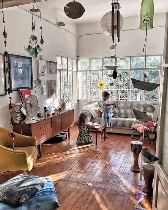 The indoor sitting area with large bright window and views of a mediterranean garden of fig trees and cactus fruit!