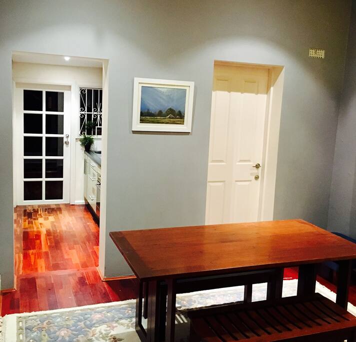 Cozy dining room where you can enjoy a scrumptious home cooked meal, and relax with a book from our book collection.