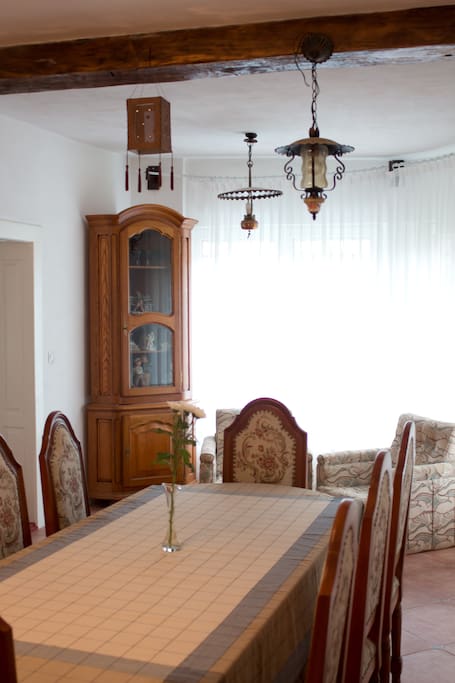 Dining area: small coffee and tea corner, wooden ceiling beams, authentic vintage Romanian lighting