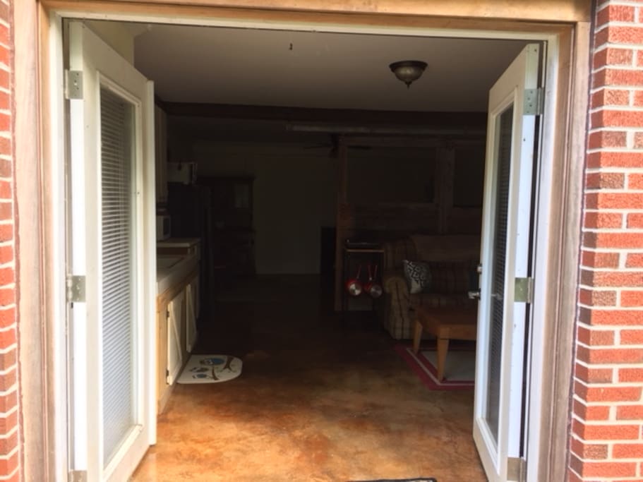 French doors let in lots of light. Doesn't feel like a basement apartment when you are inside! Tons of privacy!