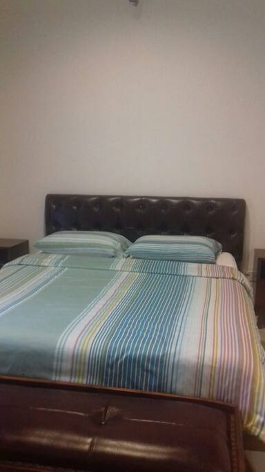 Main bed, queen size with 2 bedside tables