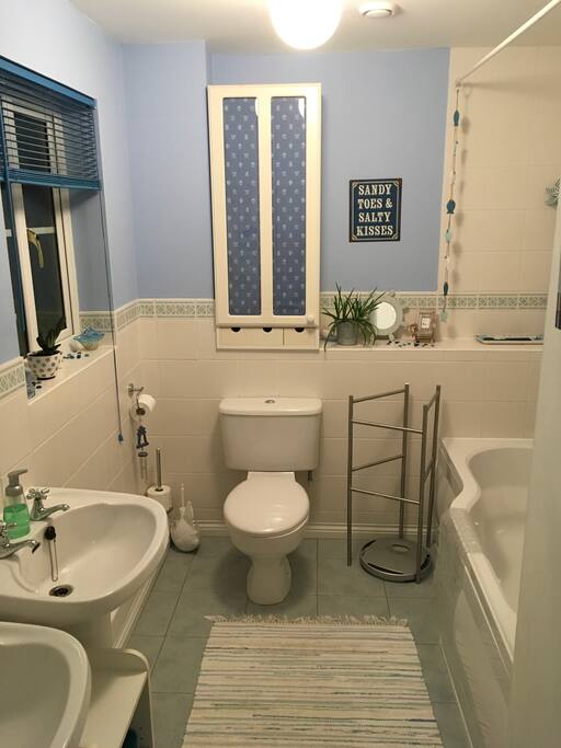Large bathroom two washbasins & shower over bath