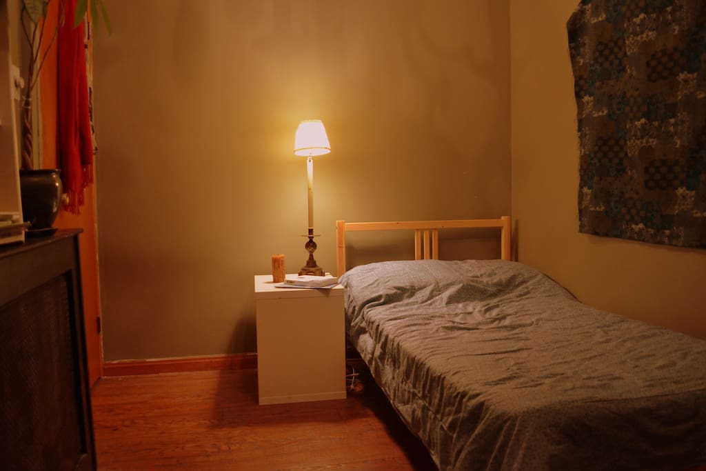 Twin bed with bedside lamp