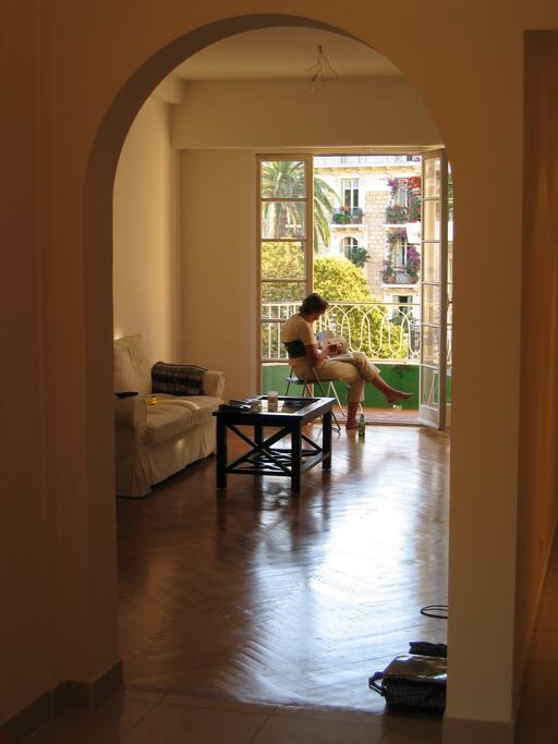 The living room opens up to the street-facing balcony