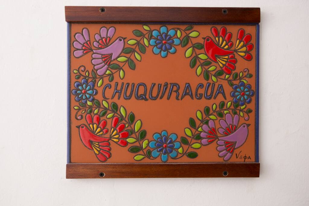 Handcrafted ceramic plaque, adorned with Ecuadorian artist design, and personalized with the apartment's name