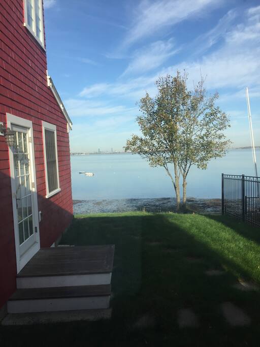 2 large windows look out from private bedroom to the bay and Boston skyline!