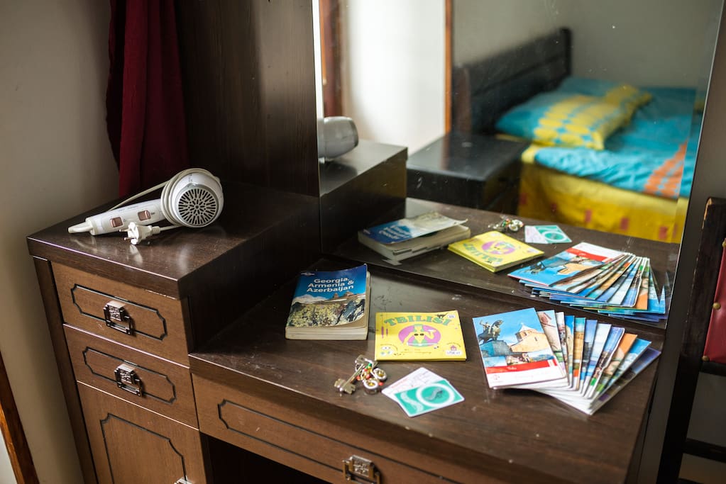 Pier-glass, hair dryer, different maps/guides and plastic cards for local transport.