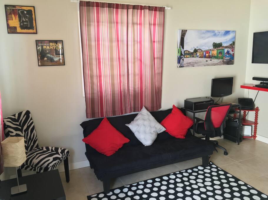 Futon sleeper and living room area.
