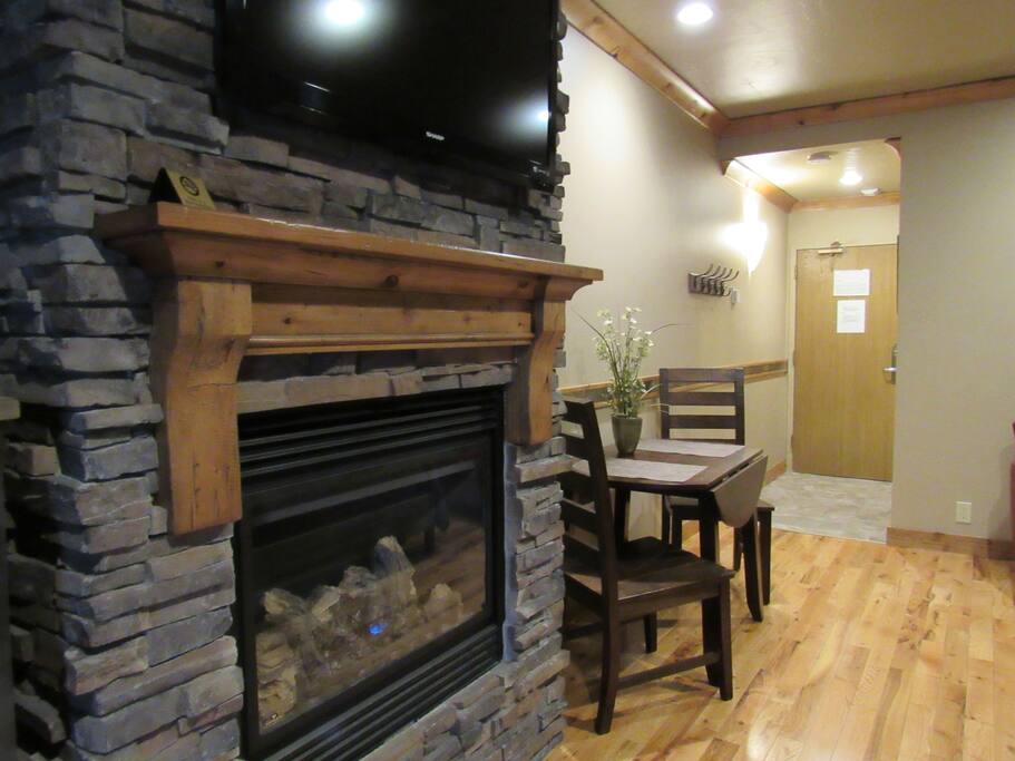 Stone floor-to-ceiling fireplace