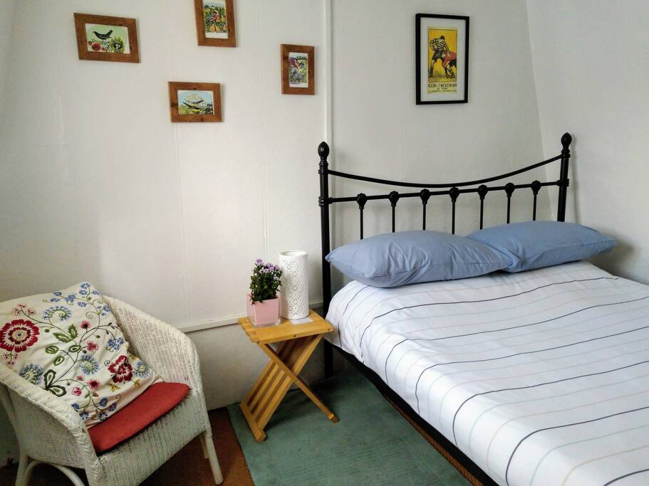 Double bed in cosy roof-top room
