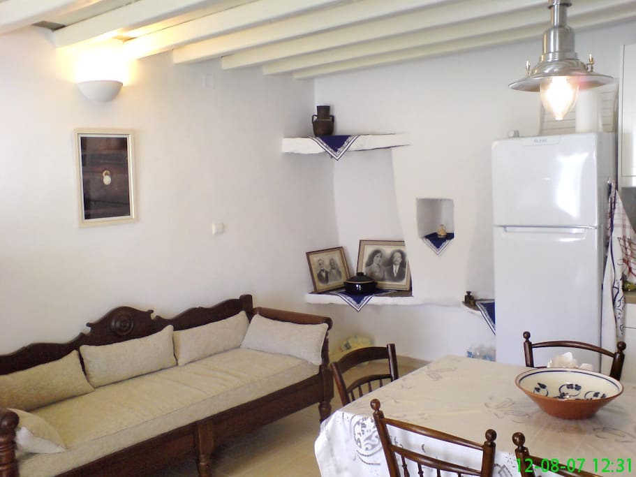 Entering the house - couch, traditional corner, dining room. (Couch may be used as single bed)