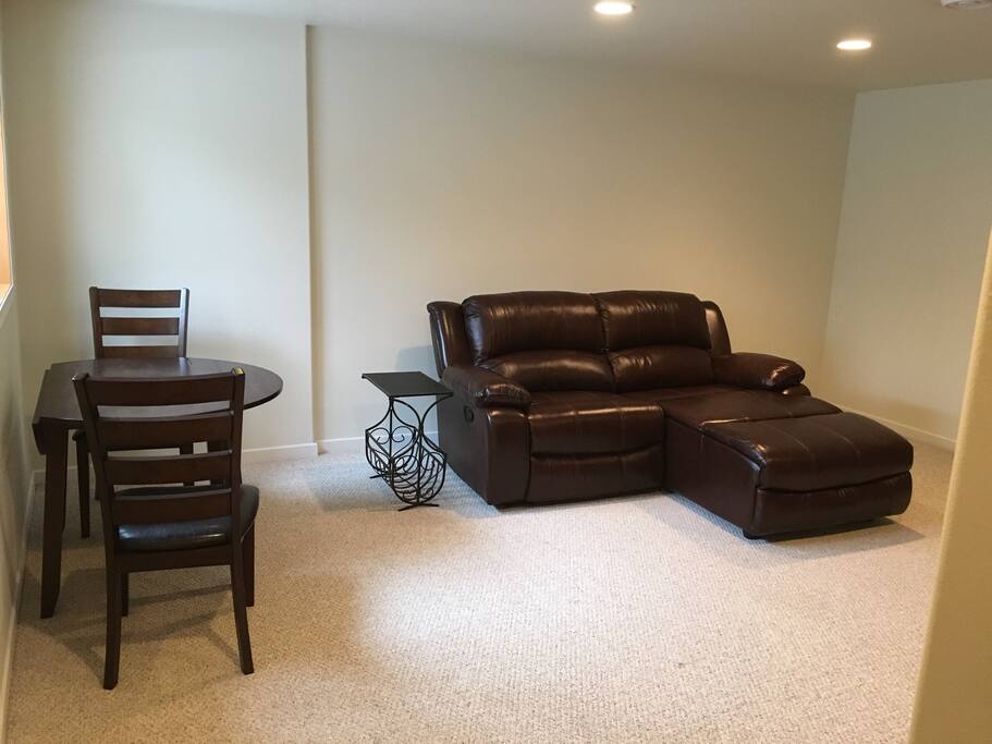 Comfy reclining leather sofa with chaise lounge.