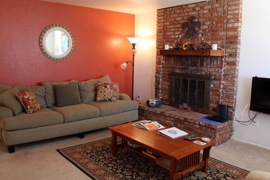 Big comfy couch, guest book in living room