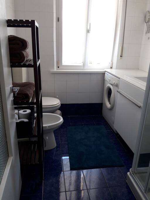 Bathroom with washing machine.