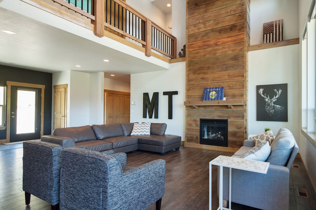 Open concept living room with grand fire place