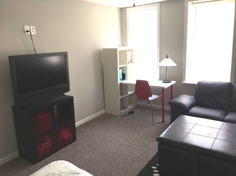 TV and desk in bedroom