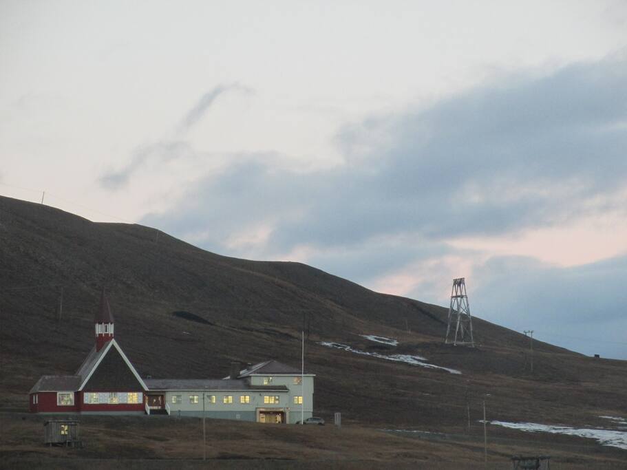The world's northernmost church view from the living room, the last rays of the sun on the church window visible