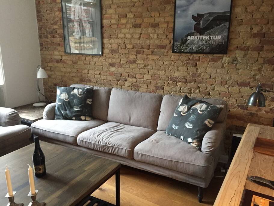 Living Room #1: Large, cosy and well-lit living room with two big couches, a flat-screen TV, chair and large open space