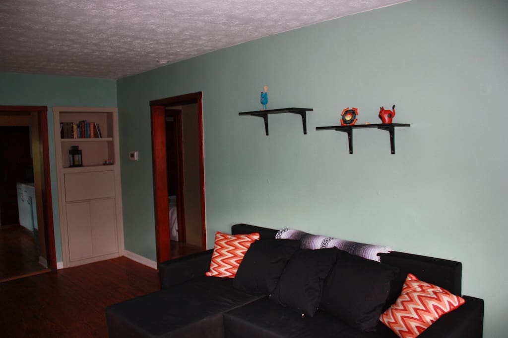 Living room couch can convert to bed.