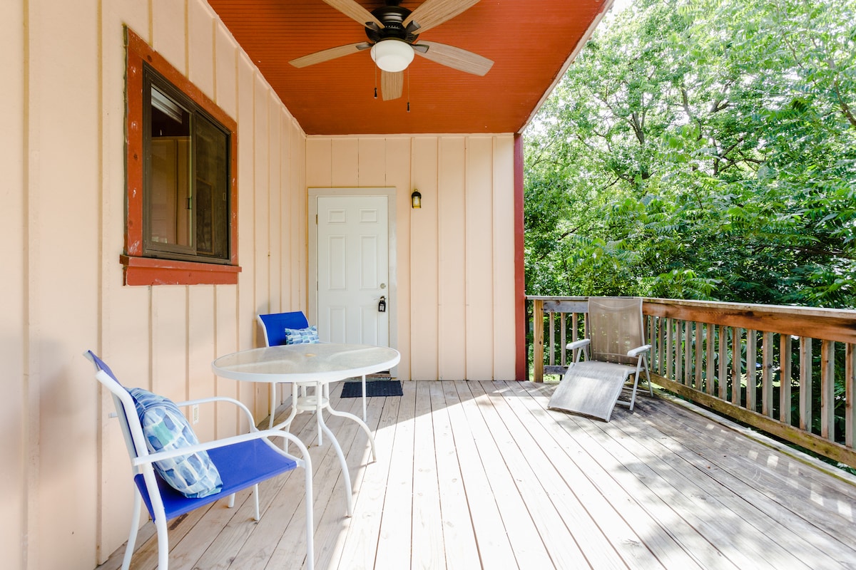 Secluded tree house apartment with high ceilings.