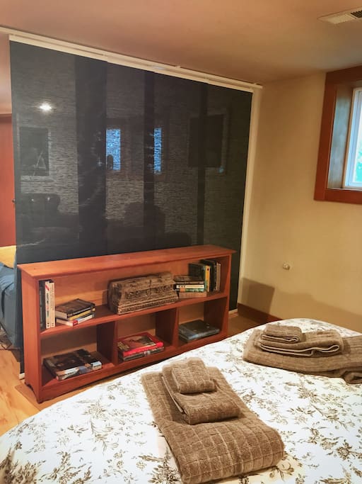Artful translucent screens adorn & divide the bed/living space