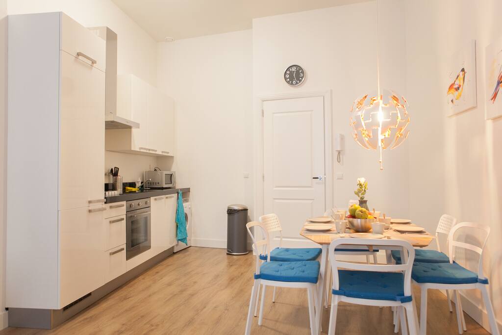 View dining area and complete kitchen with nespresso machine