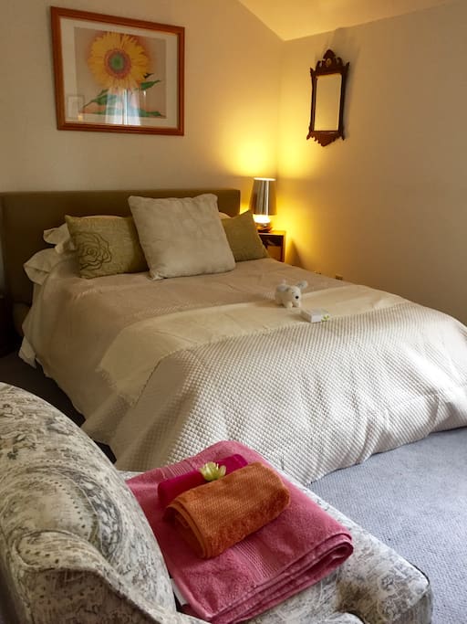 Summer bedding, note the white fluffy toy put on the bed for a guest who has a white fluffy dog she had left at home