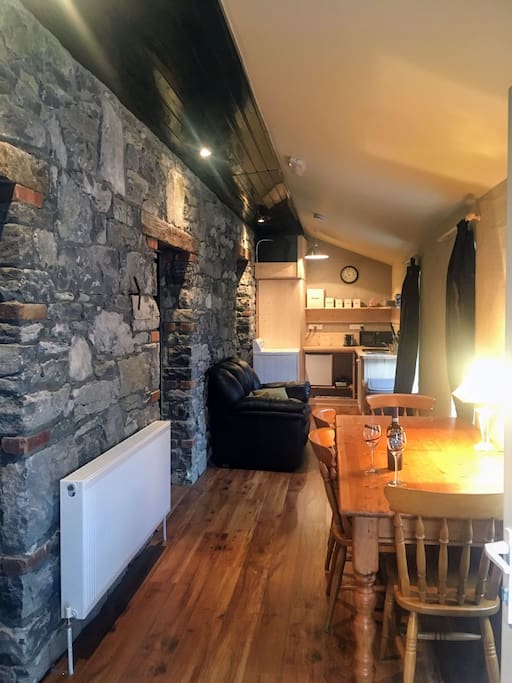 Living area with TV, stereo, mini library, games and jigsaws to keep you entertained during your stay