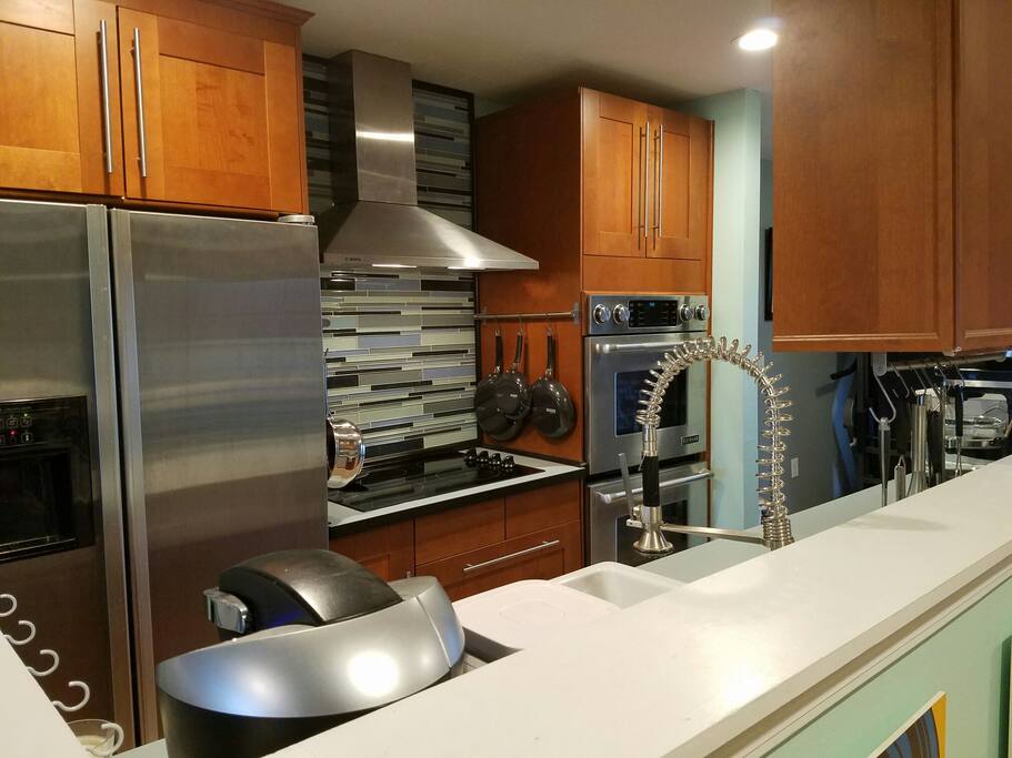 Kitchen with cooktop and double convection oven.