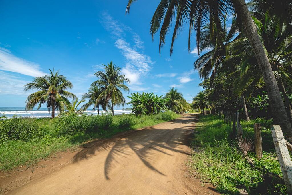 To an unspoiled 4 mile stretch of white sand