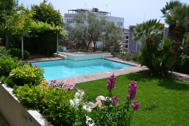 Close to the beach flat with a pool !!