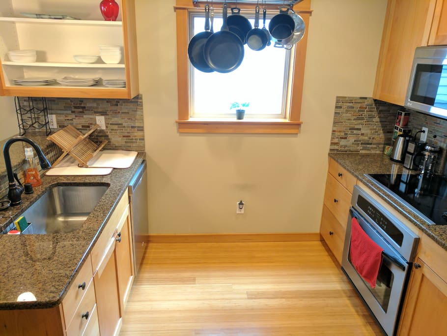 The second floor Kitchen is stocked with spices, tea, coffee, and cooking and serving basics.