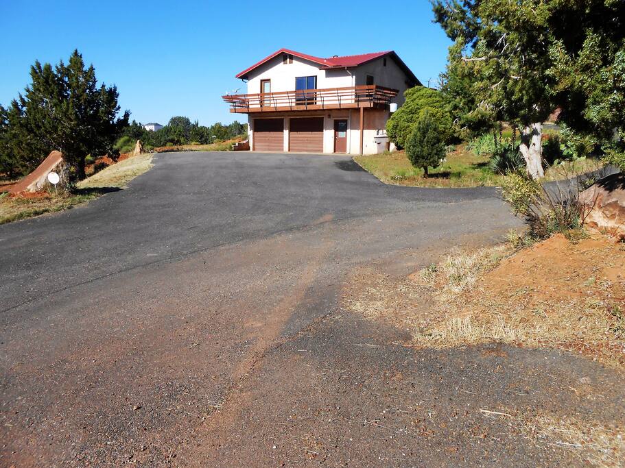 Home from the Street. Main Entrance Up Driveway to the Right. Parking on Upper or Lower Level.