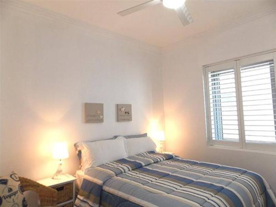 The sunlit second bedroom.