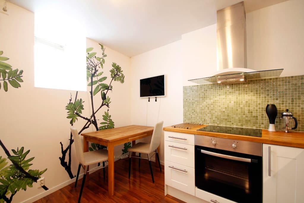 Kitchenette with dining table and seating for up to four people