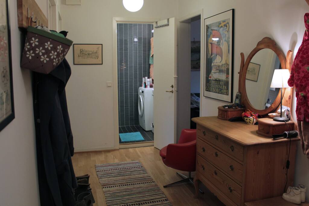 Spacious hallway. Washing machine in bathroom.