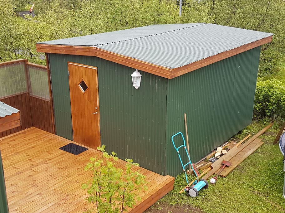 your 15 m2 cosy small house Whit brown door