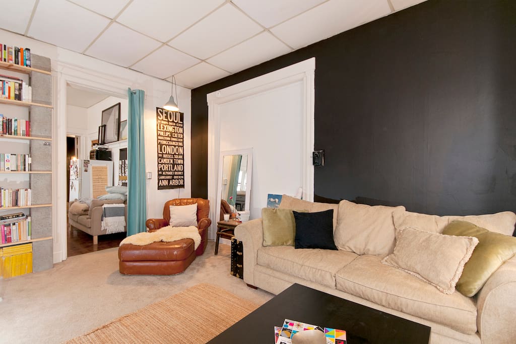 living room (door leading to kitchen with privacy curtain)