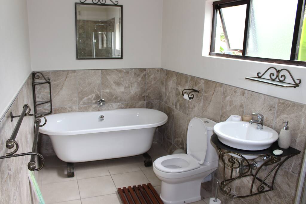 En-suite Bathroom with bath, shower and toilet