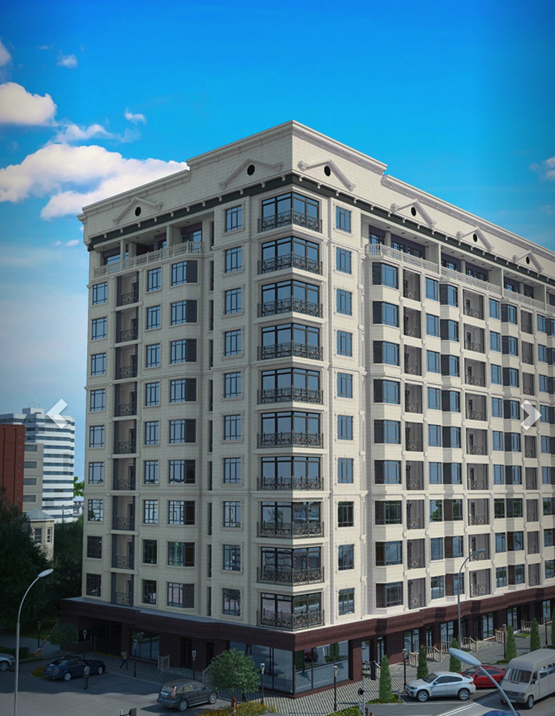 The modern building features a classic facade with multiple balconies on each level. Large windows allow for natural light, while the surrounding area includes parked cars and nearby structures, indicating a lively urban environment.