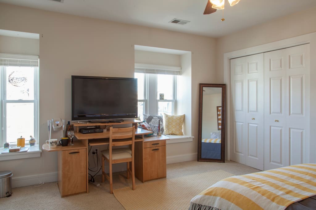 You have a desk, TV and plenty of sunlight! Also an empty closet to hang up your clothes!
