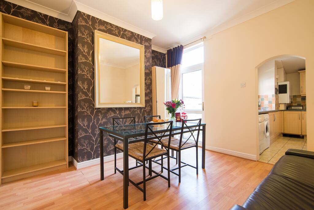 Dining room with glass door onto patio garden.