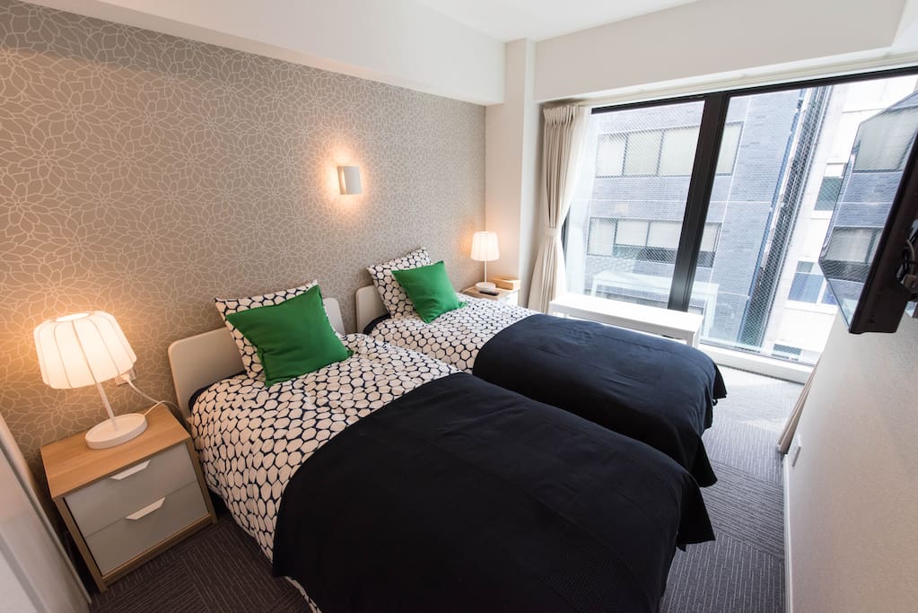 2 comfy single beds with natural light and TV