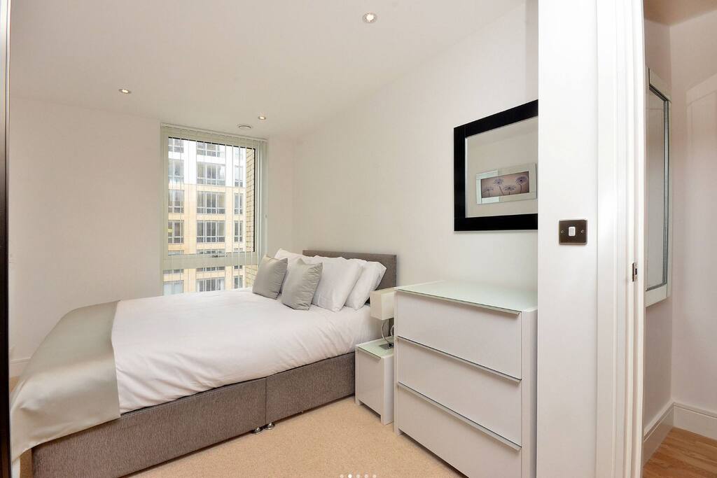 Bright and airy double bedroom with fitted cupboards and wardrobes.