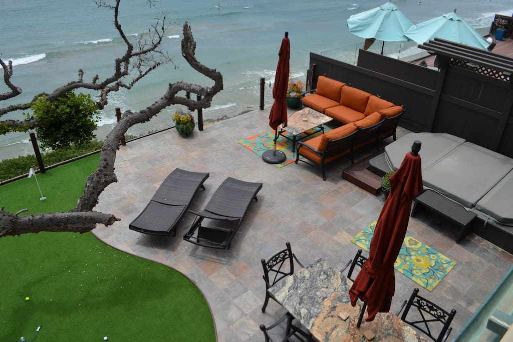 Outdoor area includes a granite grill/bar, putting green, huge jacuzzi/pool, granite dining table and living room