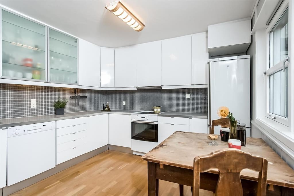 Spacious and well equipped kitchen for home cooking.