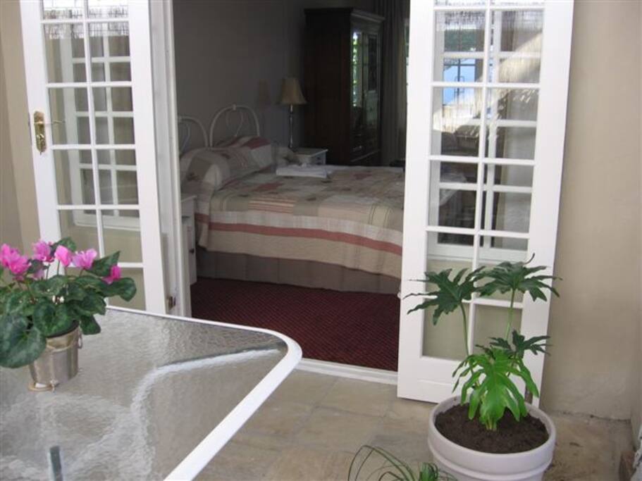 view into bedroom area from little sun room